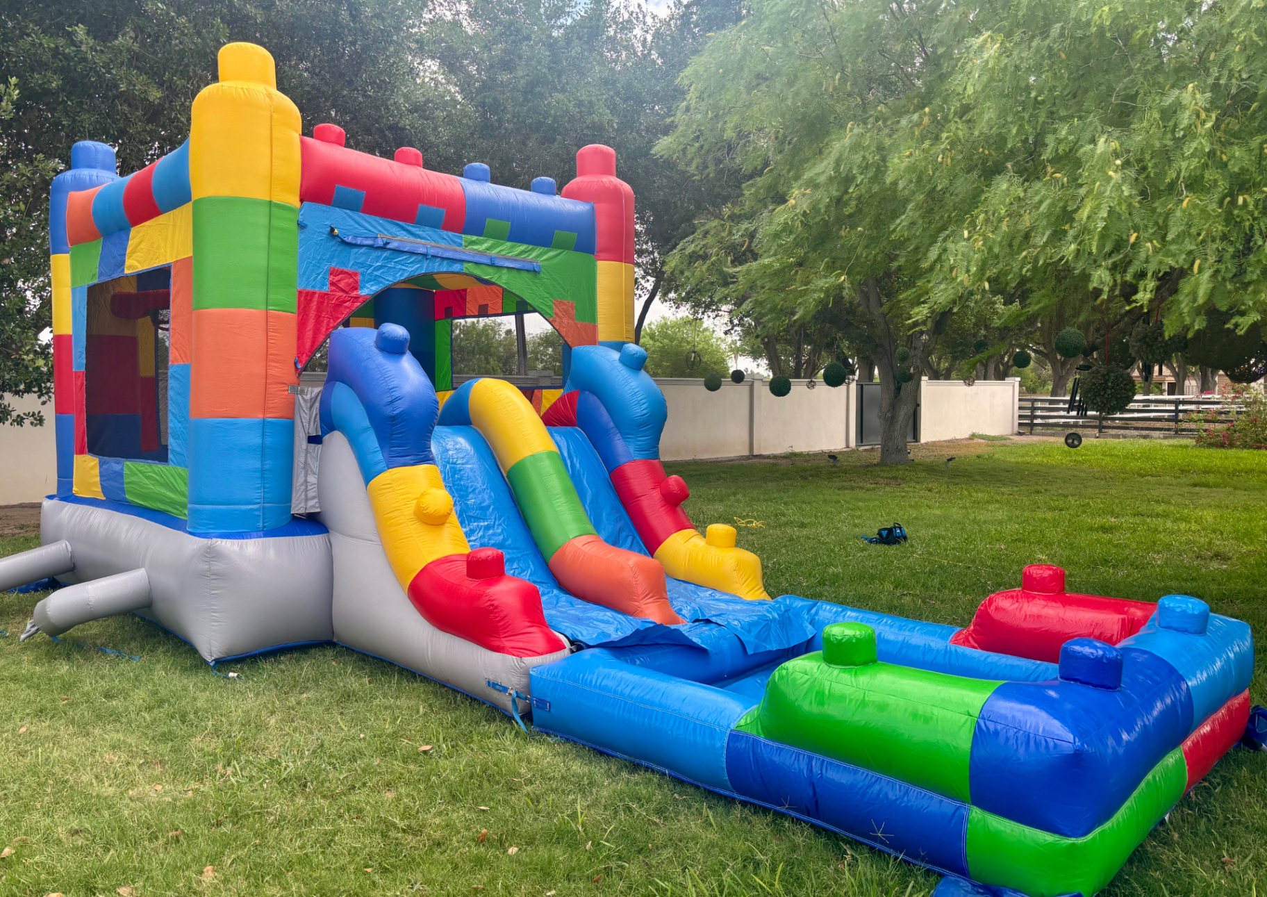 Brick Blast bounce house combo with double slide and splash pool